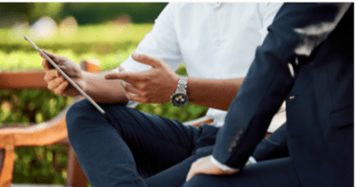 Men using tablet in business setting
